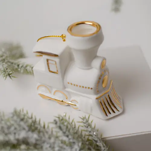 Паровозик фарфор, золото Размер: 6,1 × 3,0 × 6,0 см, вес: 44 гр. Паровозик фарфор, золото Размер: 6,1 × 3,0 × 6,0 см, вес: 44 гр. фото